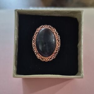 Elegant Black Stone Ring with Rose Gold Detailing